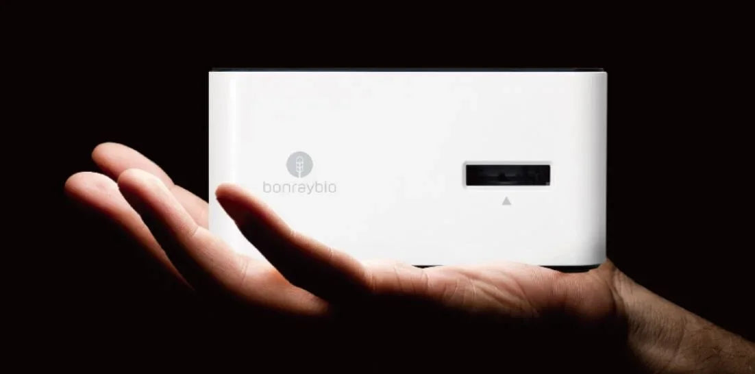LensHooke X1 PRO device resting in an open hand